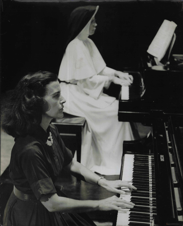 Sister Marie Rosaria and student Barbara Slate playing piano